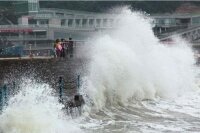 Наводнения и тайфун наносят Китаю непоправимый ущерб
